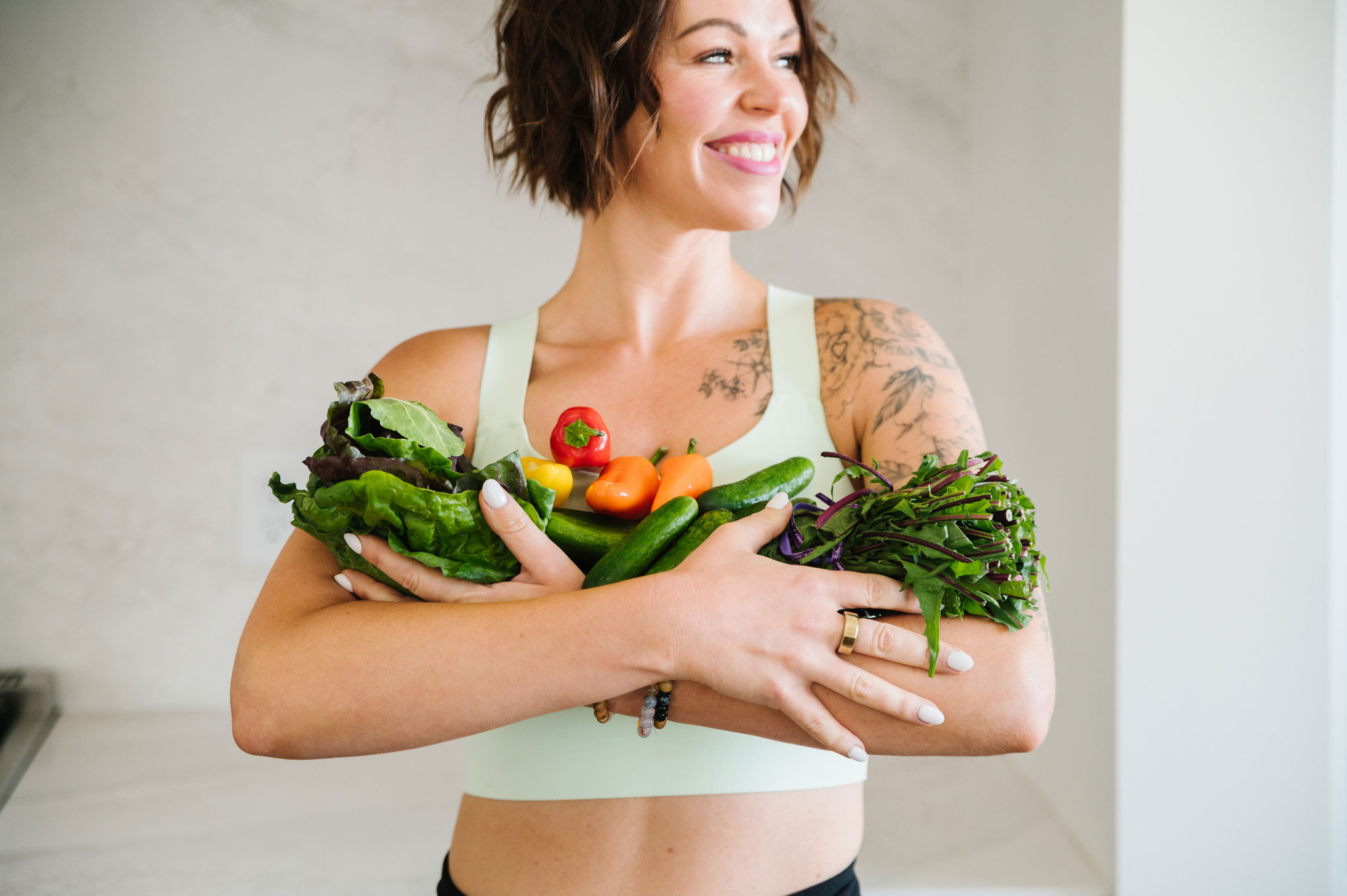 woman holding vegetables